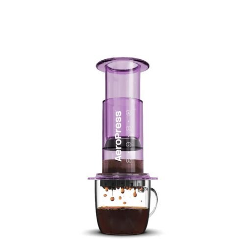 Clear AeroPress coffee maker with included accessories